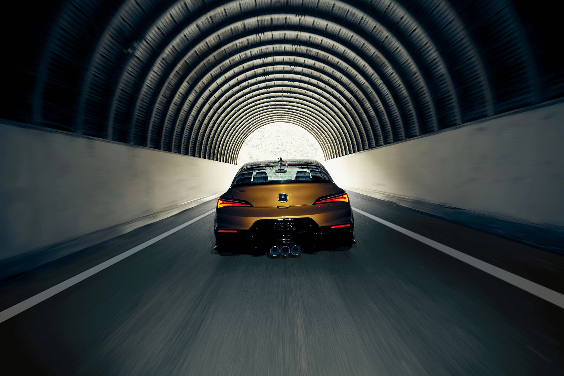 gold yellow sports car 2024 acura integra rear back speeding in city tunnel