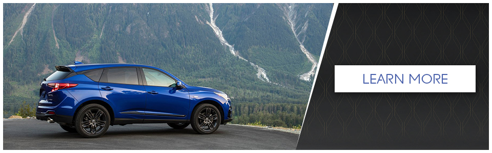 Blue Acura TLX SUV in front of a mountain for sale near Montreal