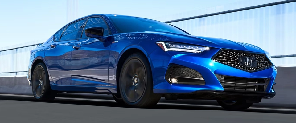 Blue 2023 Acura TLX in action